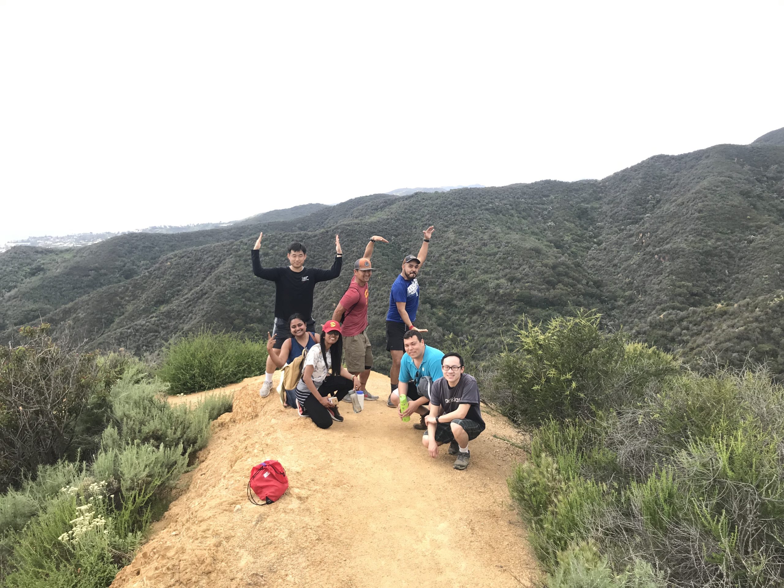 PDA members posing at the top of a hike